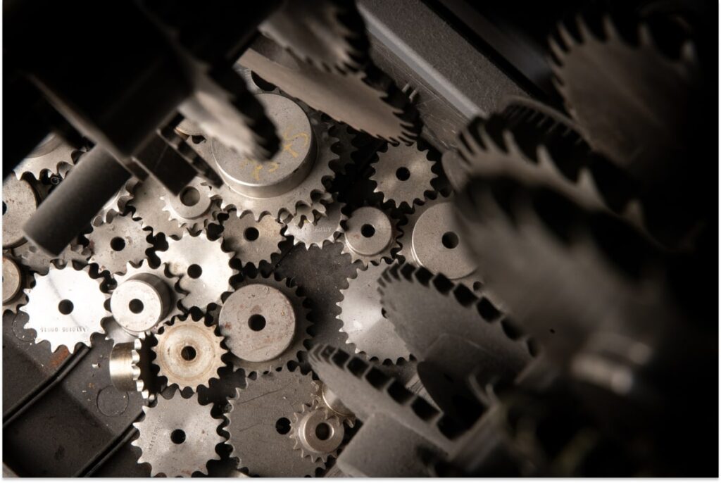 A close-up view of a machine showcasing intricate gears in motion, highlighting their mechanical design and functionality.